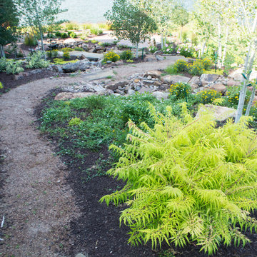 Rustic Mountain stream flowing into lakeside patio