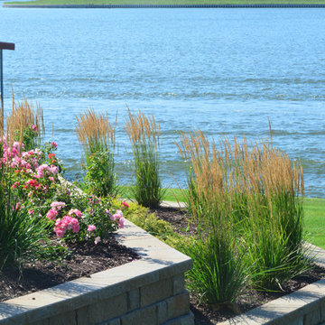 Rustic Mountain stream flowing into lakeside patio