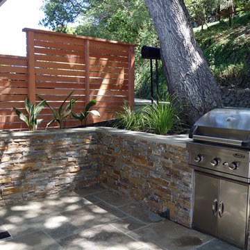 Sausalito Patio Remodel With Natural Stone and Built in Grill/BBQ and Fence