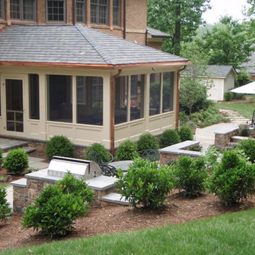 Screened Porch and Stone Patio With Outdoor Grill