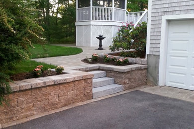 Design ideas for a mid-sized traditional partial sun front yard stone driveway in Boston.