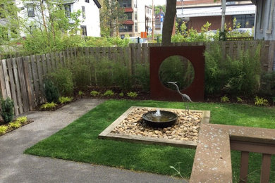 Photo of a small contemporary partial sun backyard gravel landscaping in Other for summer.