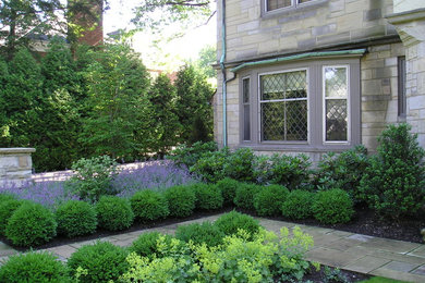 This is an example of a traditional front yard stone landscaping in Cleveland.