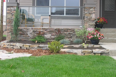 This is an example of a mid-sized rustic front yard stone garden path in Calgary.