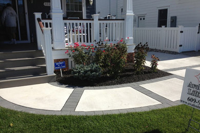 Photo of a mid-sized traditional full sun front yard concrete paver landscaping in Philadelphia.