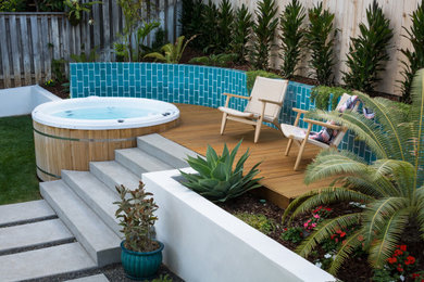 This is an example of a large contemporary back garden in San Diego with decking.