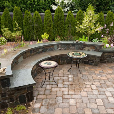 Design ideas for a large traditional backyard stone formal garden in Seattle.