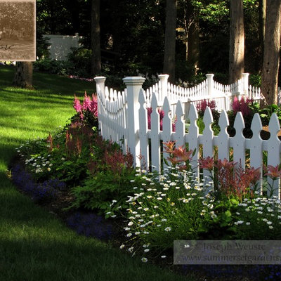 Design ideas for a mid-sized traditional partial sun backyard landscaping in Newark for spring.