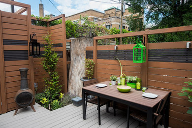 Inspiration for a small modern full sun backyard landscaping in Toronto.