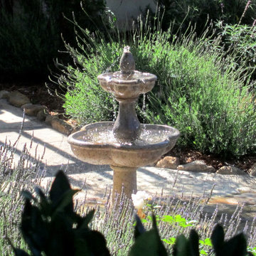 Small Spanish Cottage Landscaping with Quaint Fountain