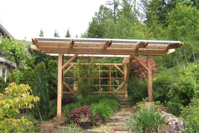 Inspiration for a large traditional back full sun pergola in Portland.