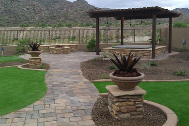 Inspiration for a large mediterranean backyard landscaping in Phoenix.
