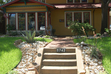 Design ideas for a mid-sized southwestern full sun front yard stone landscaping.