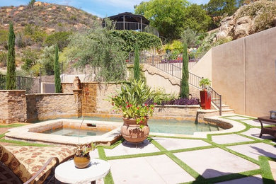 Inspiration for a large mediterranean courtyard formal garden in Orange County.