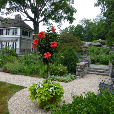 Photo of a large traditional full sun backyard formal garden in New York for summer.