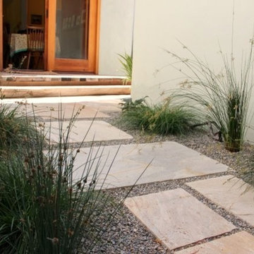 Square Pavers Banked by Arching Grasses