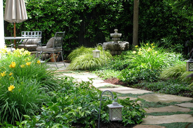 Inspiration for a mid-sized traditional partial sun backyard stone landscaping in San Francisco.