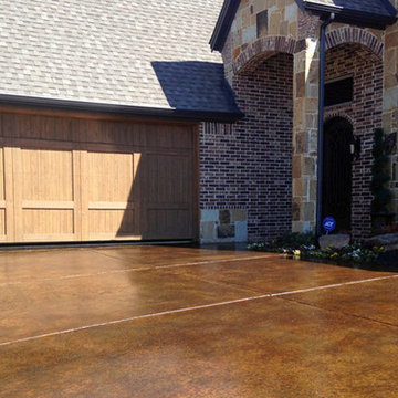 Stained Concrete Driveway Complements Brick and Stone