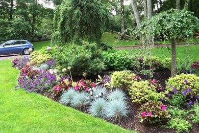 Inspiration for a large mediterranean full sun front yard gravel landscaping in New York for spring.