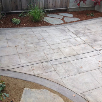 Stamped colored concrete patio with soft set flagstone