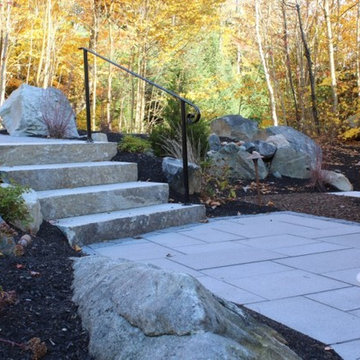 Stepped entry and custom wrought iron hand railing