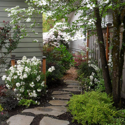 Photo of a small traditional partial sun backyard stone garden path in Portland for spring.
