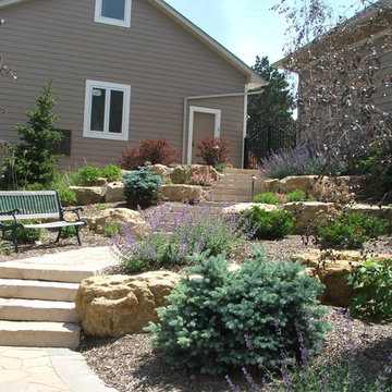 Steps, boulder outcroppings and plant beds