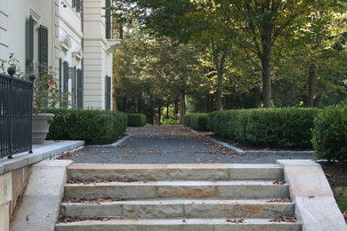 This is an example of a large traditional partial sun gravel formal garden in Boston.