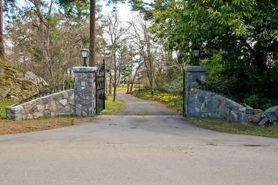 Stone and iron gates at driveway entrance