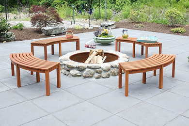 Example of a large trendy backyard concrete paver patio design in Boston with a fire pit