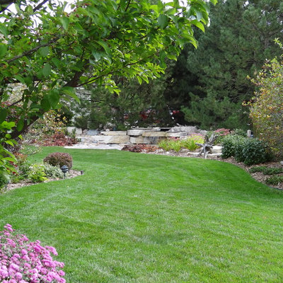 Inspiration for a contemporary water fountain landscape in Milwaukee.