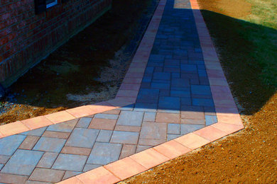 Stone paver walkway constructed by Quality Concrete & Masonry