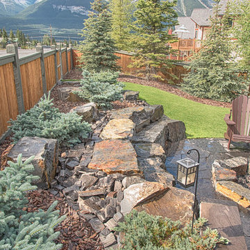 Stone Seating Retaining Wall & Rundle Stone Tailings with Bark Nuggets