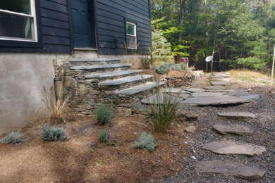 Design ideas for a mid-sized rustic partial sun side yard stone garden path in New York for fall.