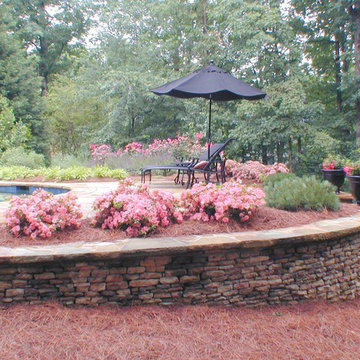 Stone walls level pool area and decking