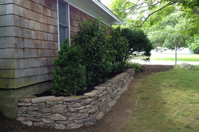 Design ideas for a stone retaining wall landscape in Boston.