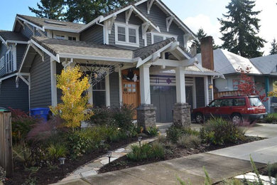 This is an example of a small modern drought-tolerant and full sun front yard stone garden path in Portland.