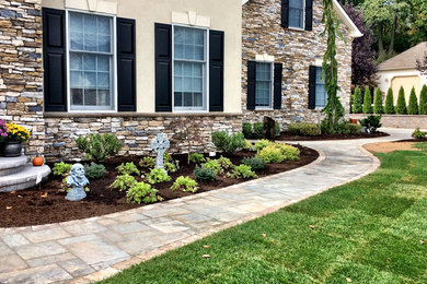 Photo of a modern front yard stone landscaping in Philadelphia.