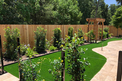 This is an example of a backyard stone landscaping in Houston.