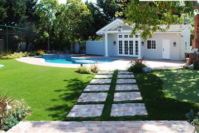 Design ideas for a large classic back partial sun garden for summer in Los Angeles with an outdoor sport court and brick paving.