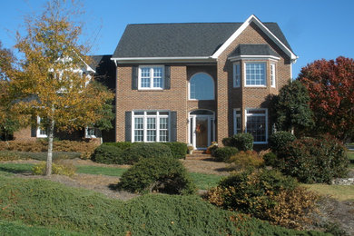 Photo of a large traditional full sun front yard landscaping in Raleigh.