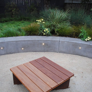 Temescal Family Garden -   Steel Fire Pit with Ipe Table Cover