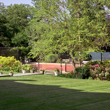 Tennis court and back lawn