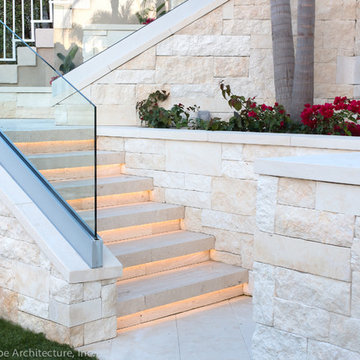 Terraced Backyard with Limestone Stairs and Glass Railing
