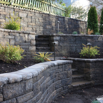 Terrraced Retaining Wall With Steps Leading To Upper Patio