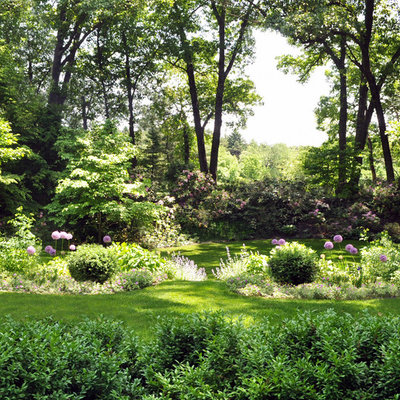 Photo of a large traditional shade backyard stone landscaping in Boston for summer.