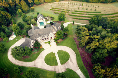 This is an example of a huge traditional concrete paver formal garden in Atlanta.