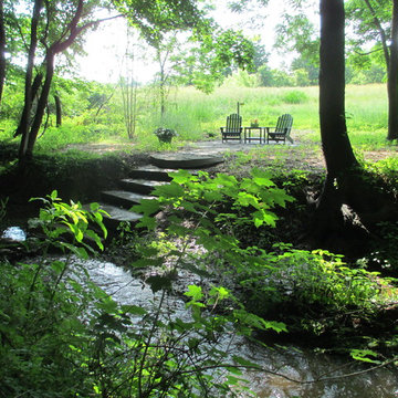 the following spring, note the Japanese inspired stone steps thru the creek