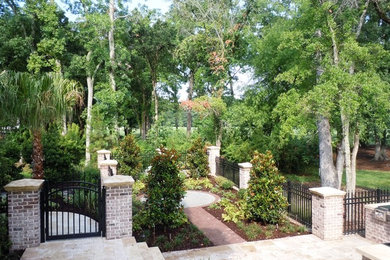 Design ideas for a contemporary courtyard brick garden path in Charleston for winter.