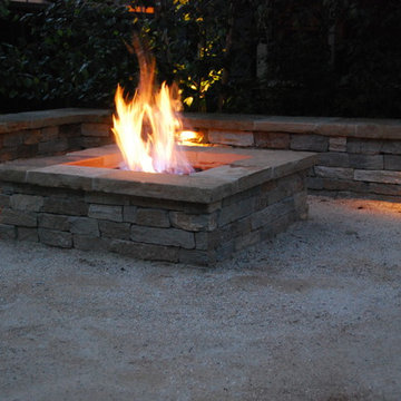 The legs of the seatwall are at different distances from the fire pit, to allow